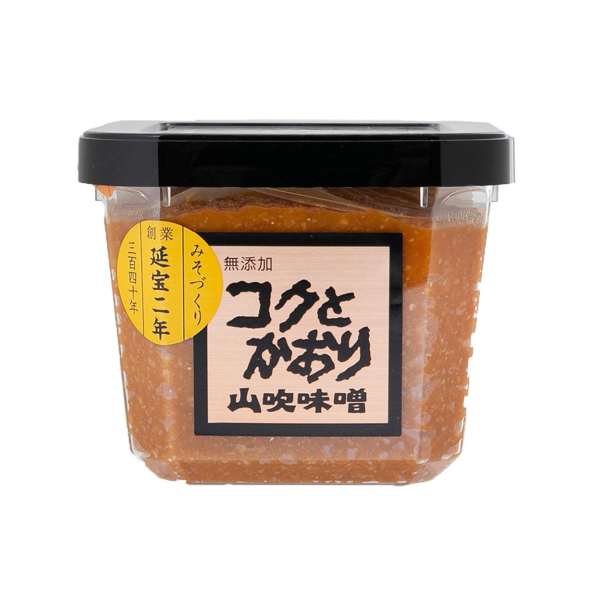 Miso paste jar with clear container and black lid, labeled SHINSYUMISO