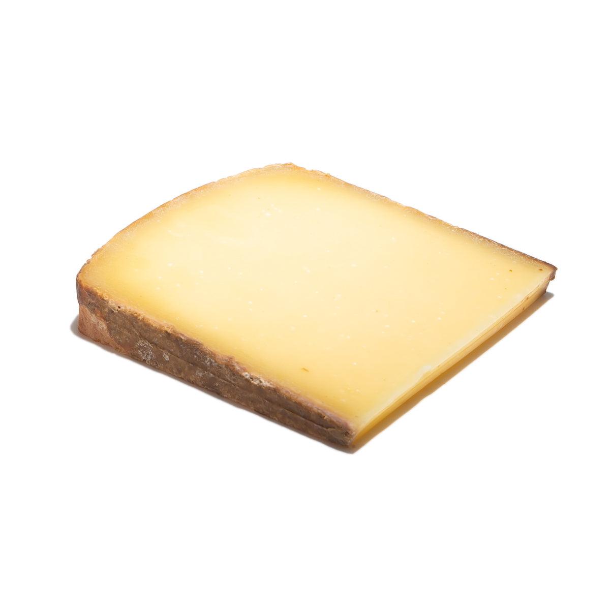 LES FRERES MARCHAND Comte AOP cheese wedge with yellow interior and brown rind