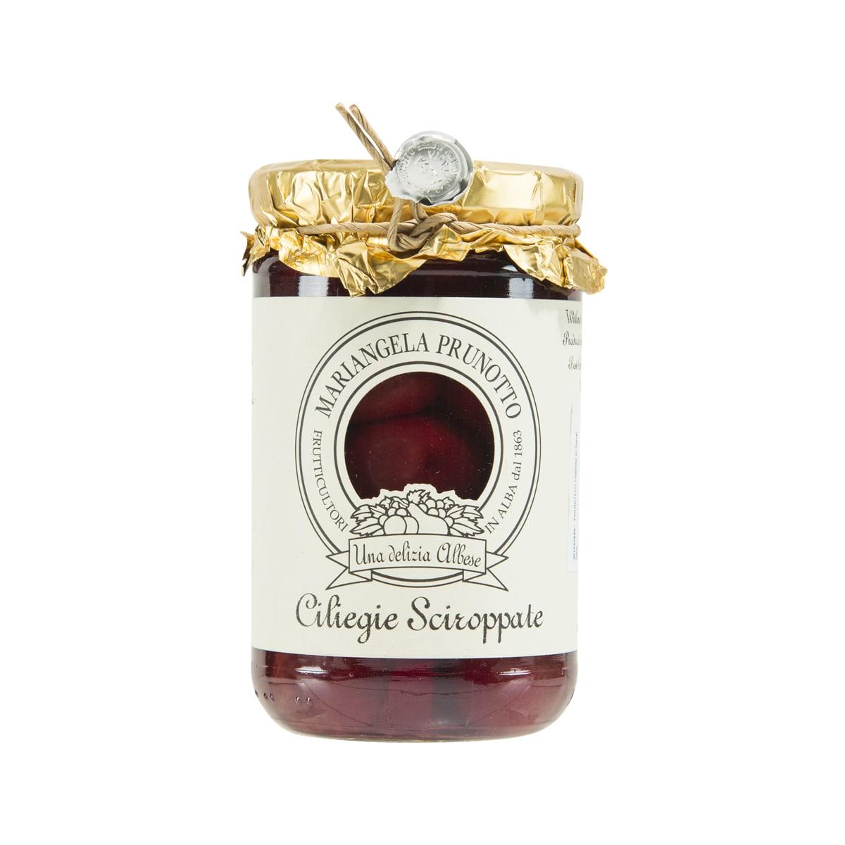 PRUNOTTO cherries in syrup jar with dark red contents, gold wrapped lid