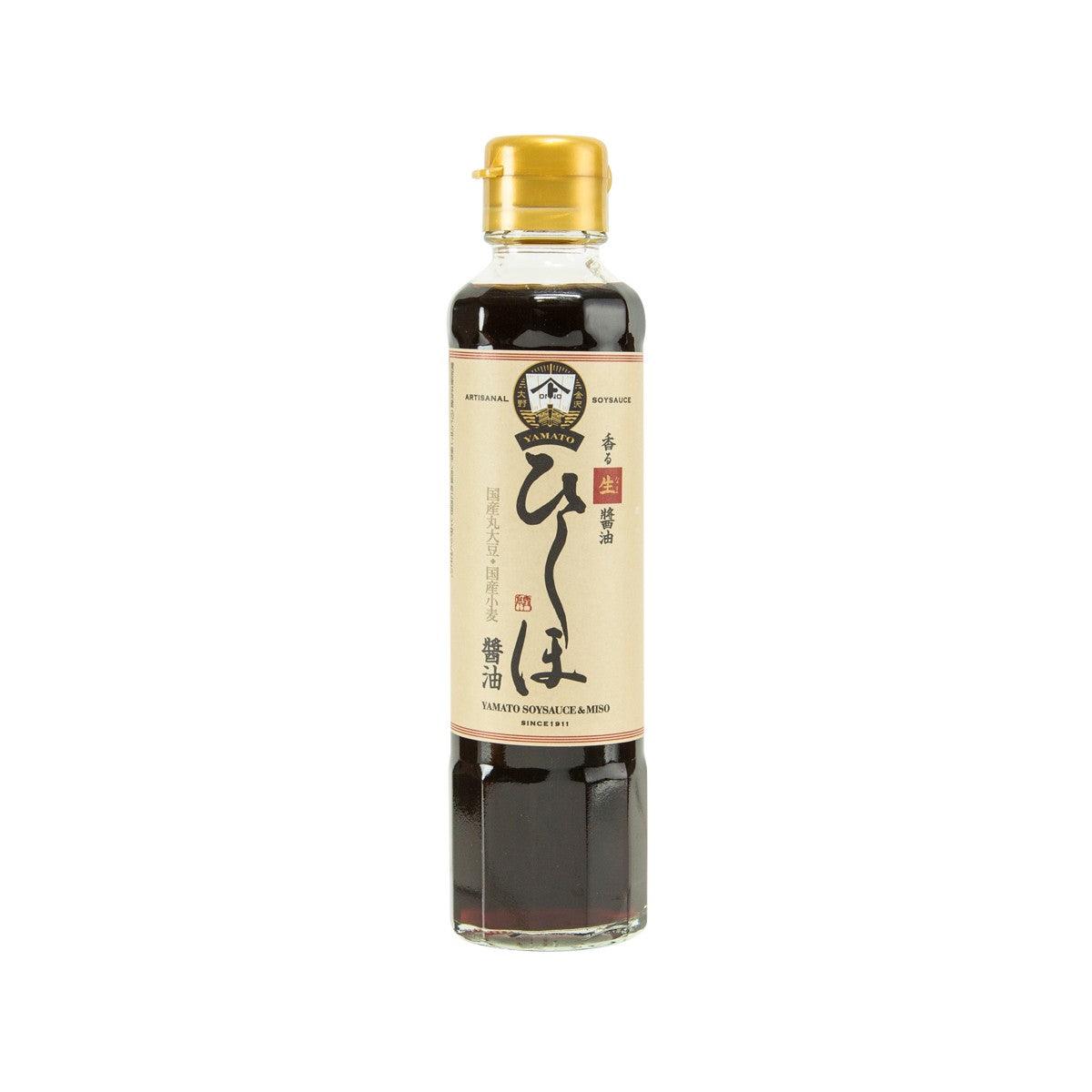 Raw soy sauce in clear glass bottle with gold screw cap and label