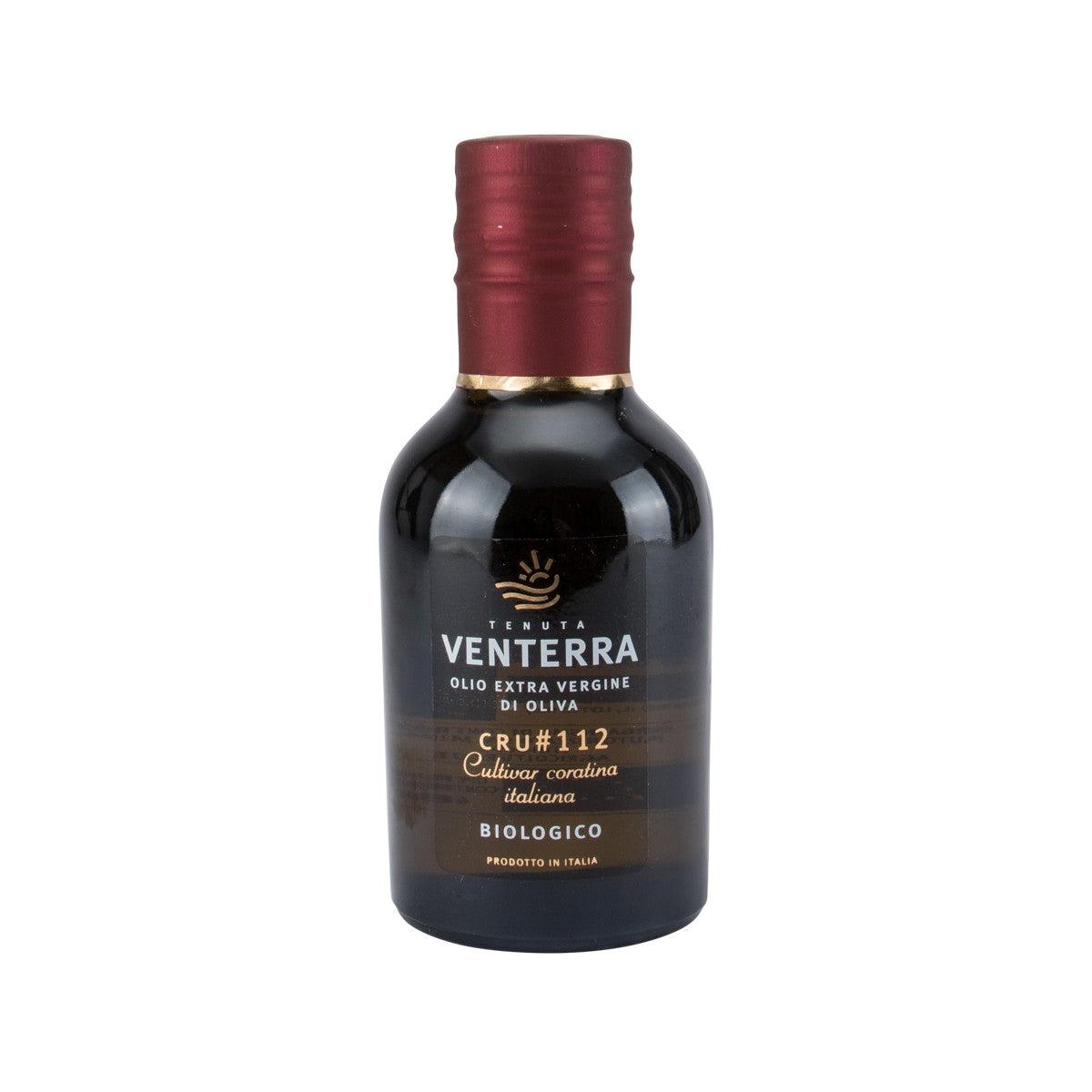 Extra virgin olive oil bottle with burgundy cap and dark label