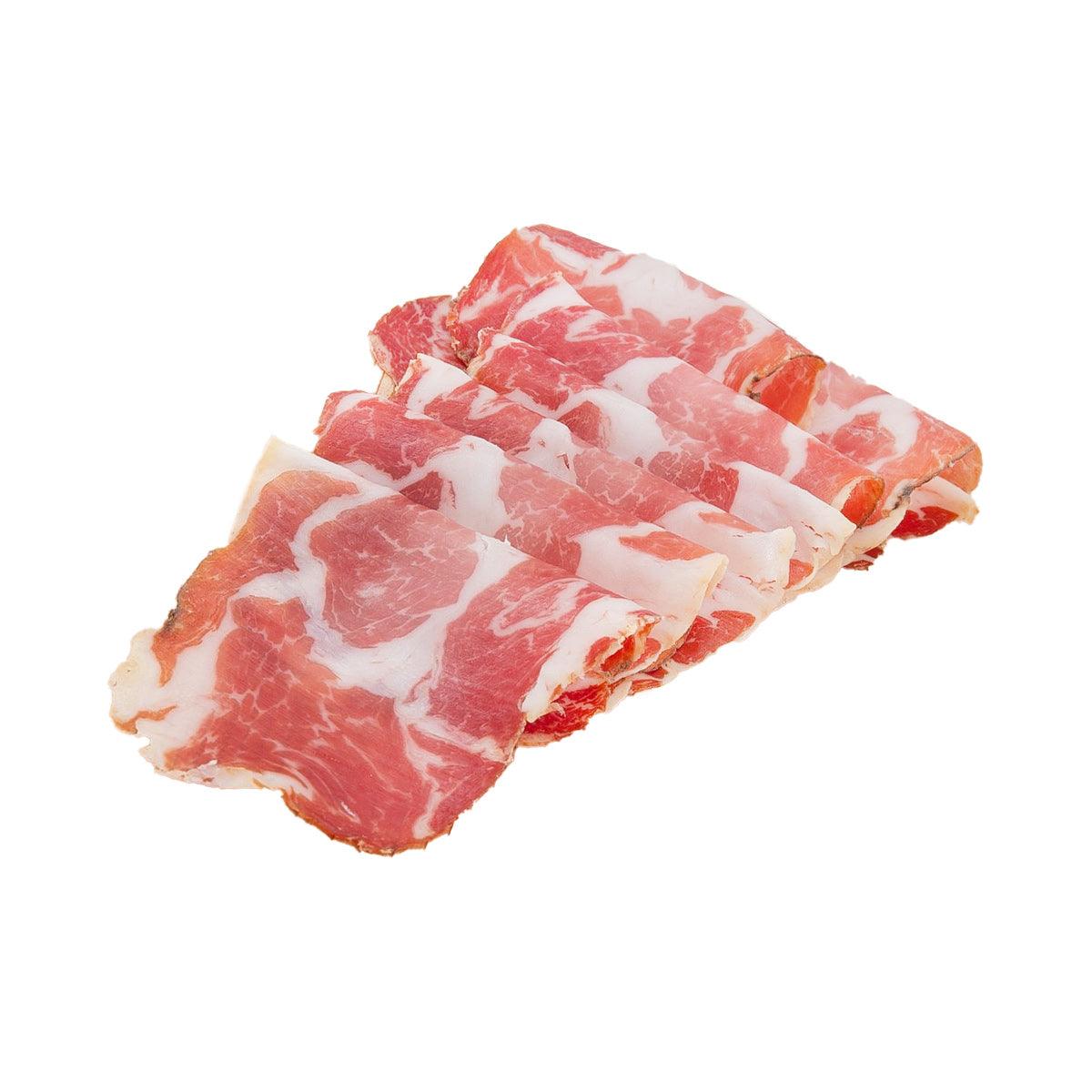 Cured coppa ham slices, red pork with white fat marbling stack