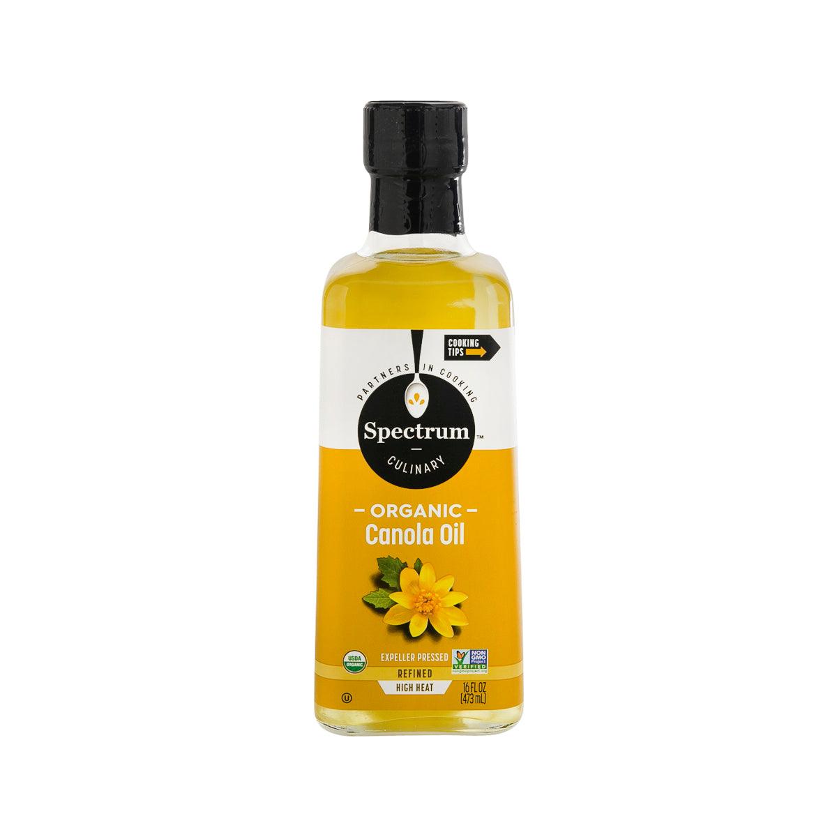 Spectrum organic canola oil bottle, amber liquid with black cap and label
