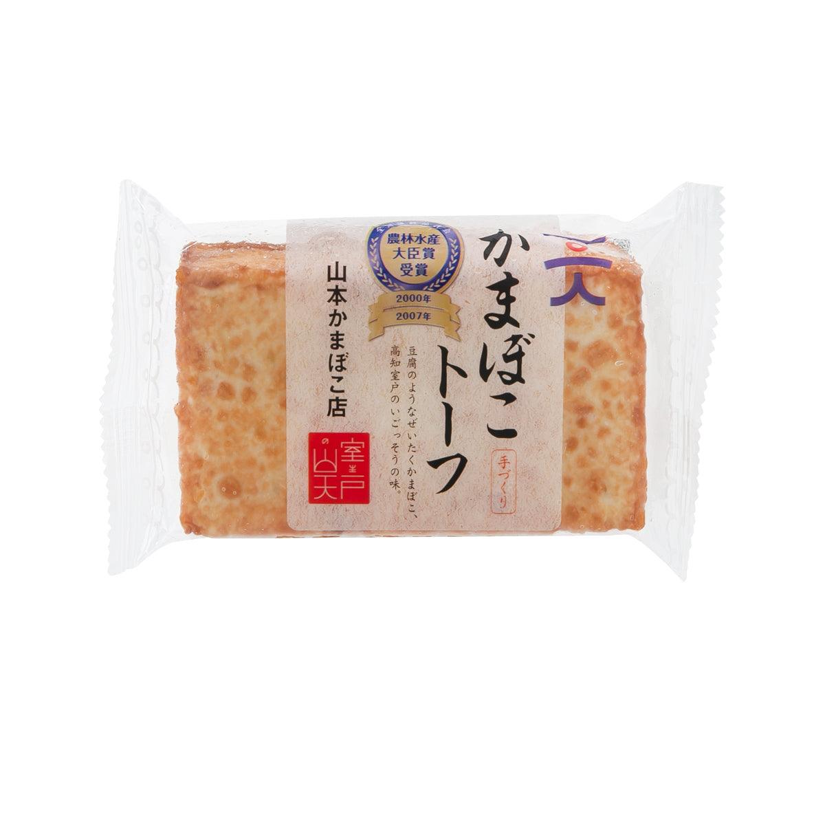 Wrapped tofu-style kamaboko fish cake, rectangular brown slices with front label