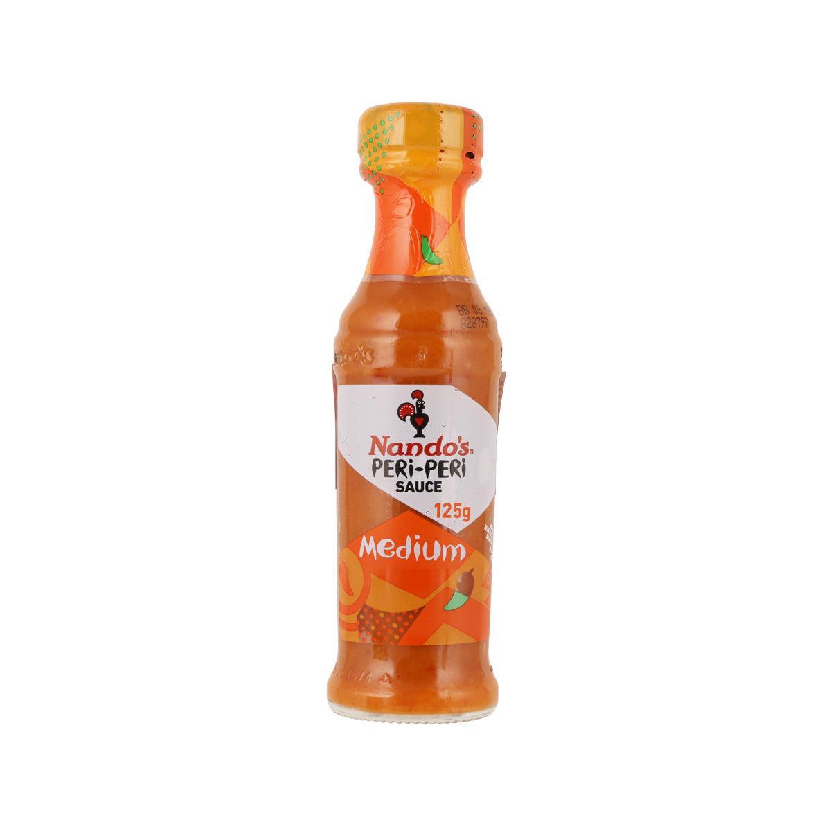 NANDO'S medium peri-peri sauce bottle, 125 g, orange bottle with red label