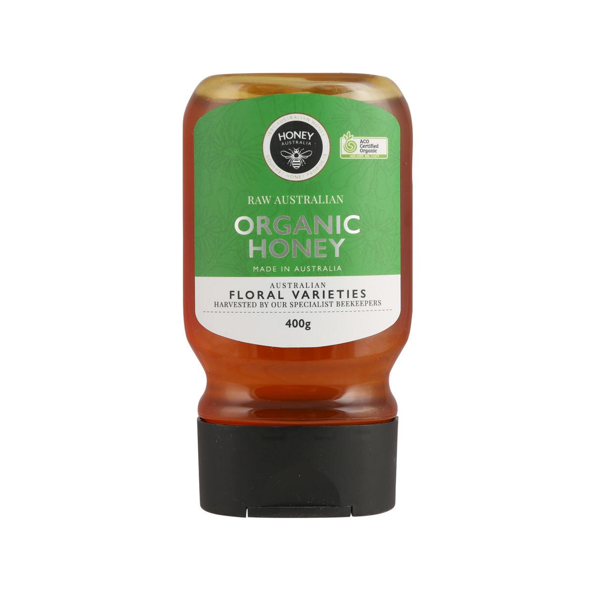 Organic honey squeeze bottle, amber honey in translucent bottle with black cap