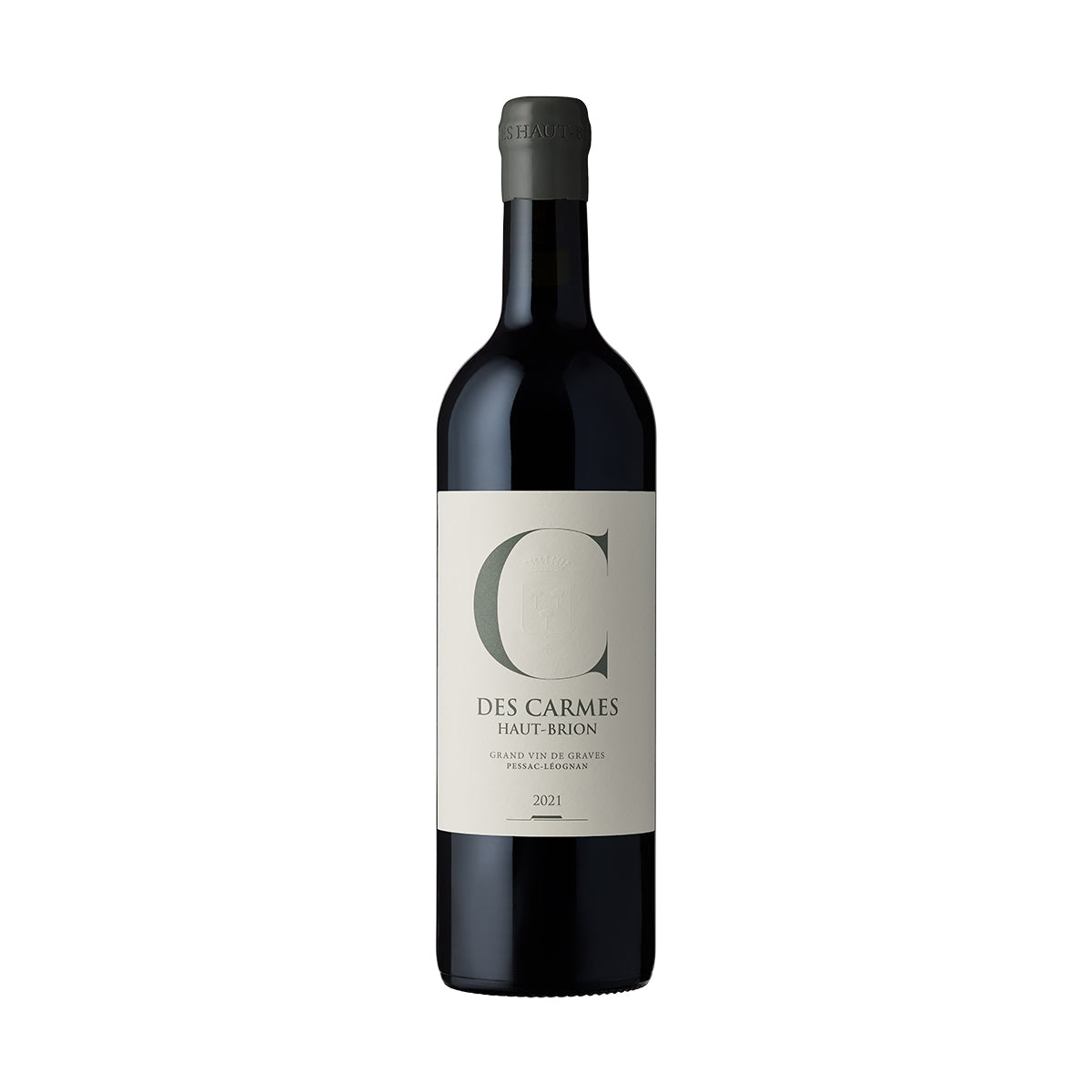 Wine bottle with dark glass and cream label, green letter C, vintage 2021.