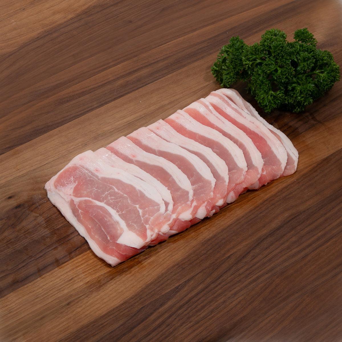 Pork belly slab with pink meat and white fat stripes
