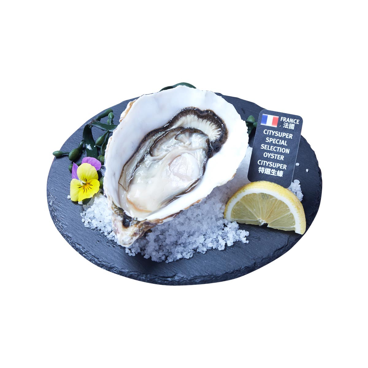 Oyster halves on slate with lemon wedges, greens, and ice crystals