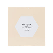 White chocolate bolt-and-nut shaped confection box with front hex product label