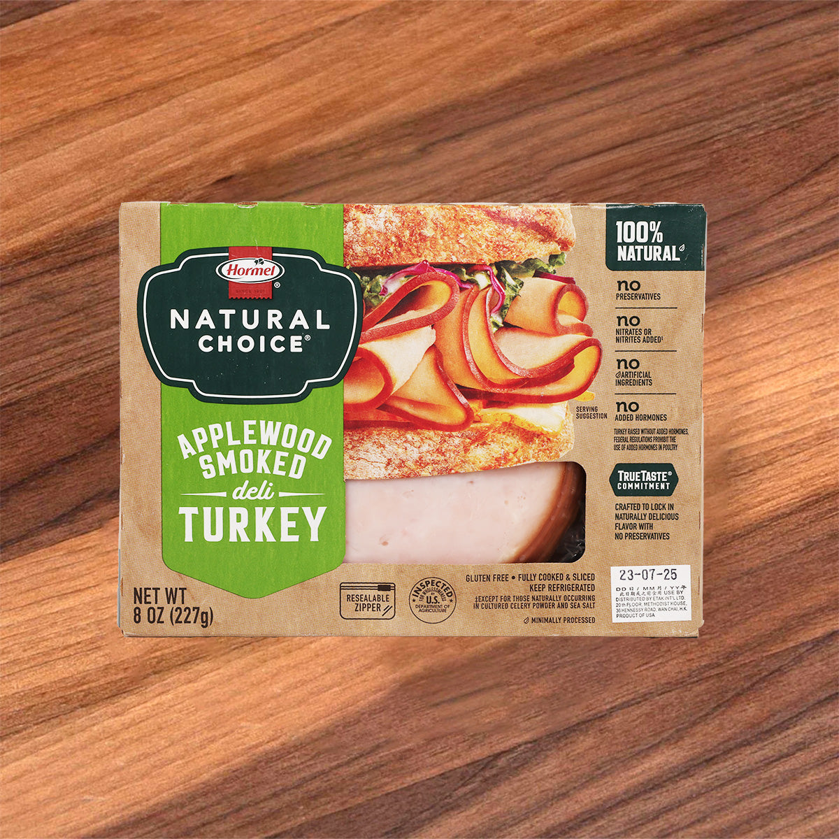 Applewood smoked turkey deli slices package with Natural Choice label, green and tan