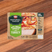 Applewood smoked turkey deli slices package with Natural Choice label, green and tan