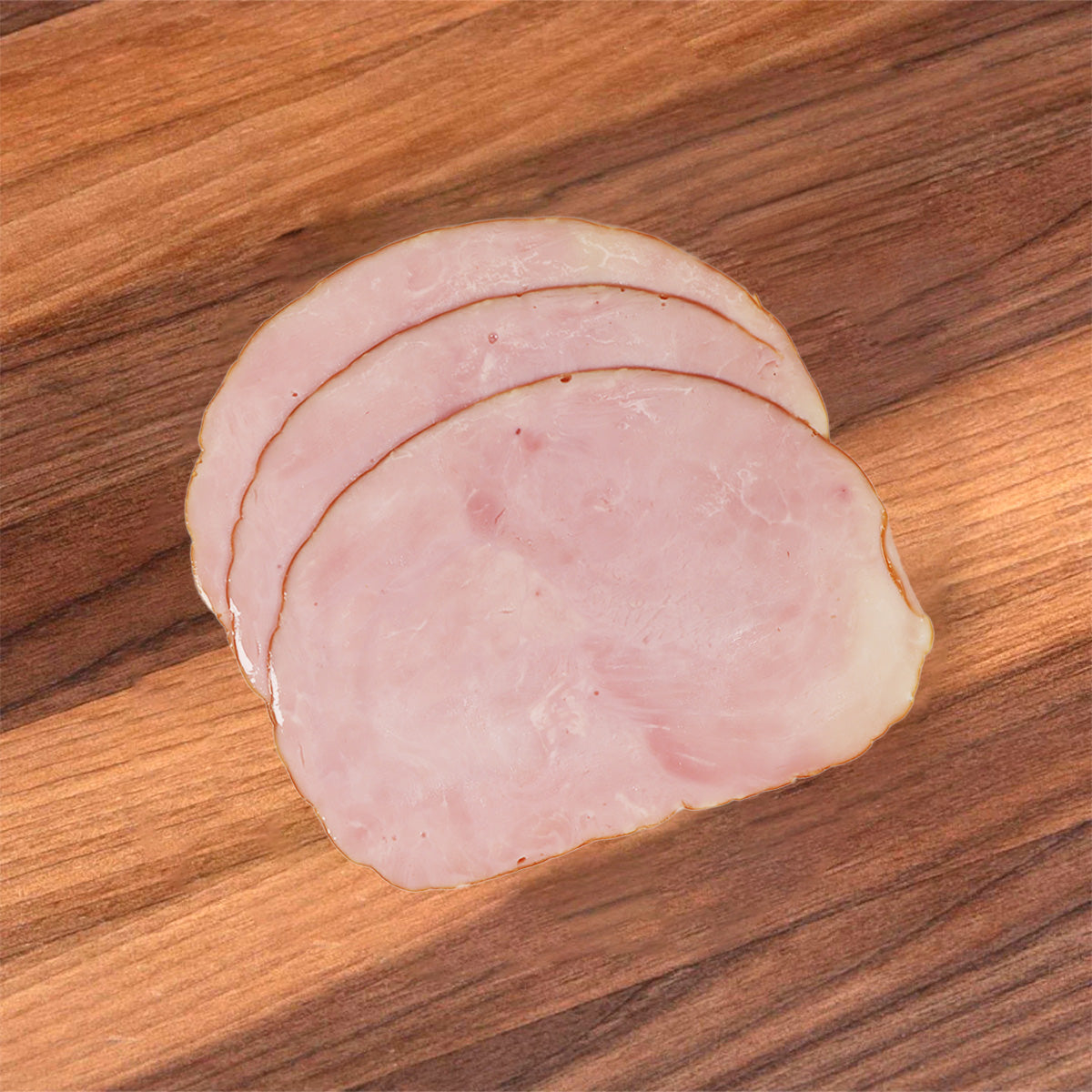 Sliced cured ham, pink round rounds with thin white fat edges
