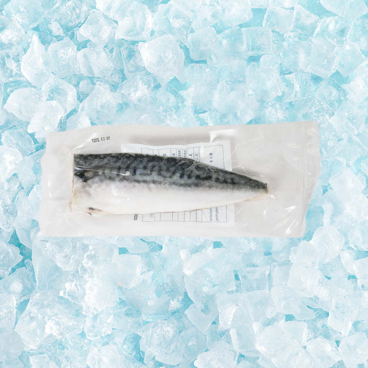 Frozen mackerel fillet in sealed clear bag, dark gray skin