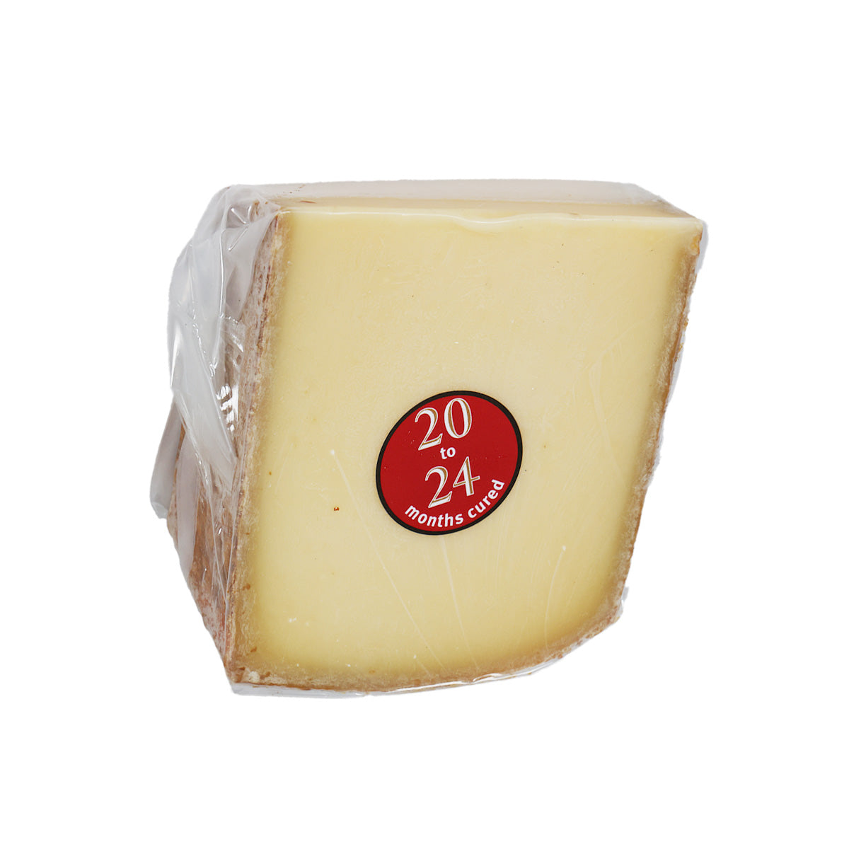 Wrapped Comte-style cheese block with red "20 to 24 months" sticker, pale yellow
