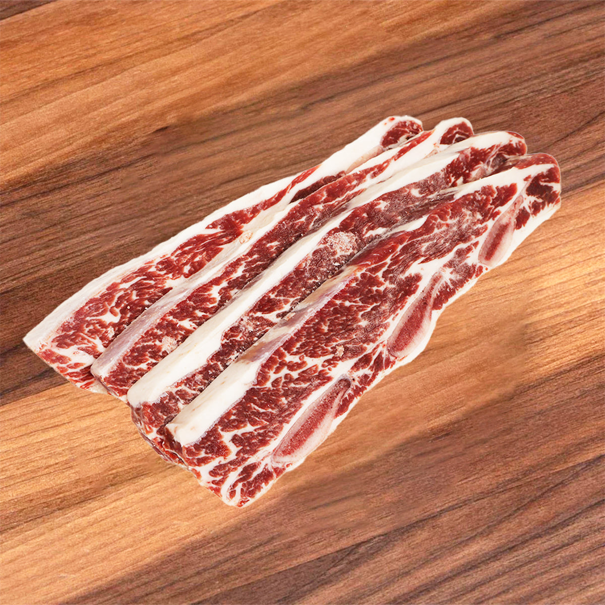 Frozen beef short ribs with marbled red meat and thick white fat strips