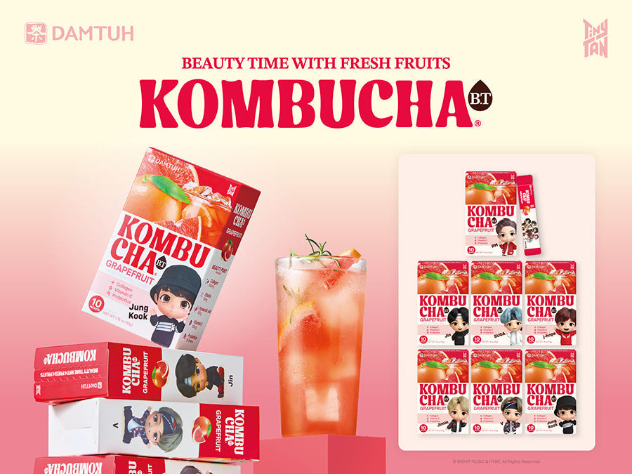 Kombucha CHA Grapefruit assorted box set with stacked packs and drink glass