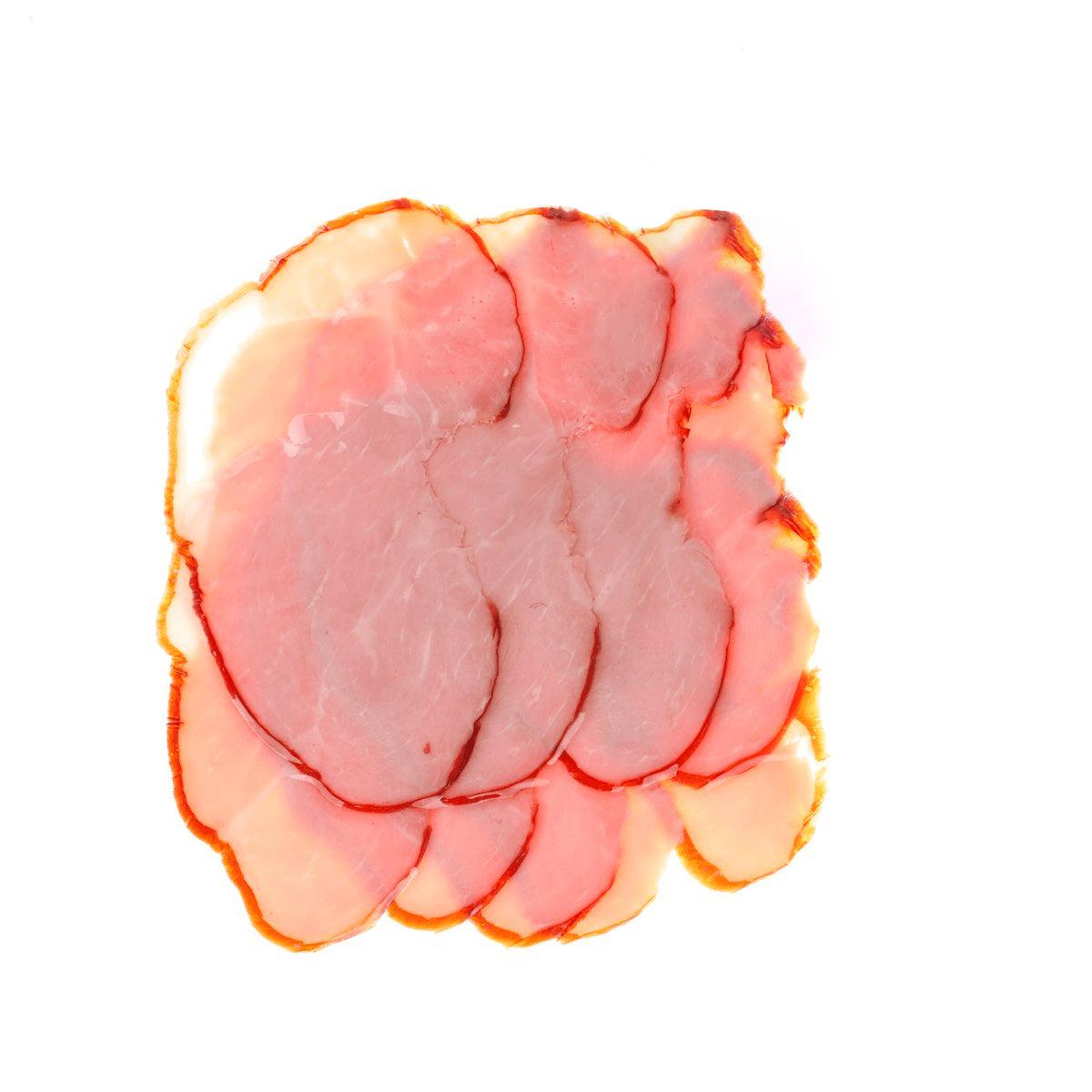 Smoked ham slices, pink cured meat with light fat edges