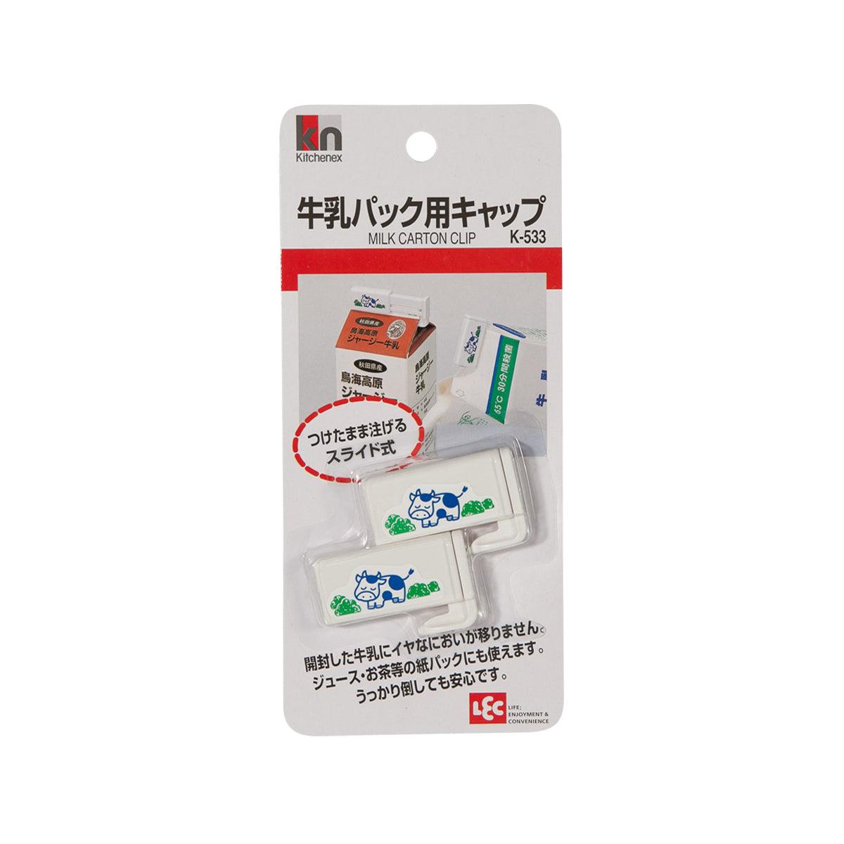 Milk carton clip in retail pack, beige clip with cow logo and orange carton icon