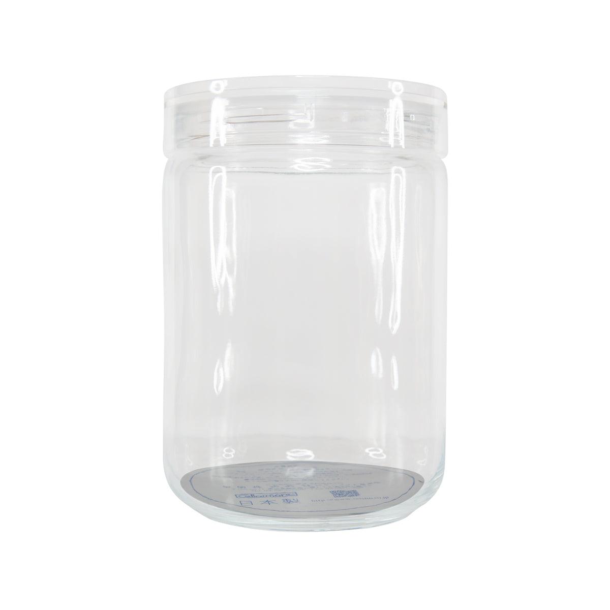 Clear plastic jar with hinged lid, cylindrical storage container