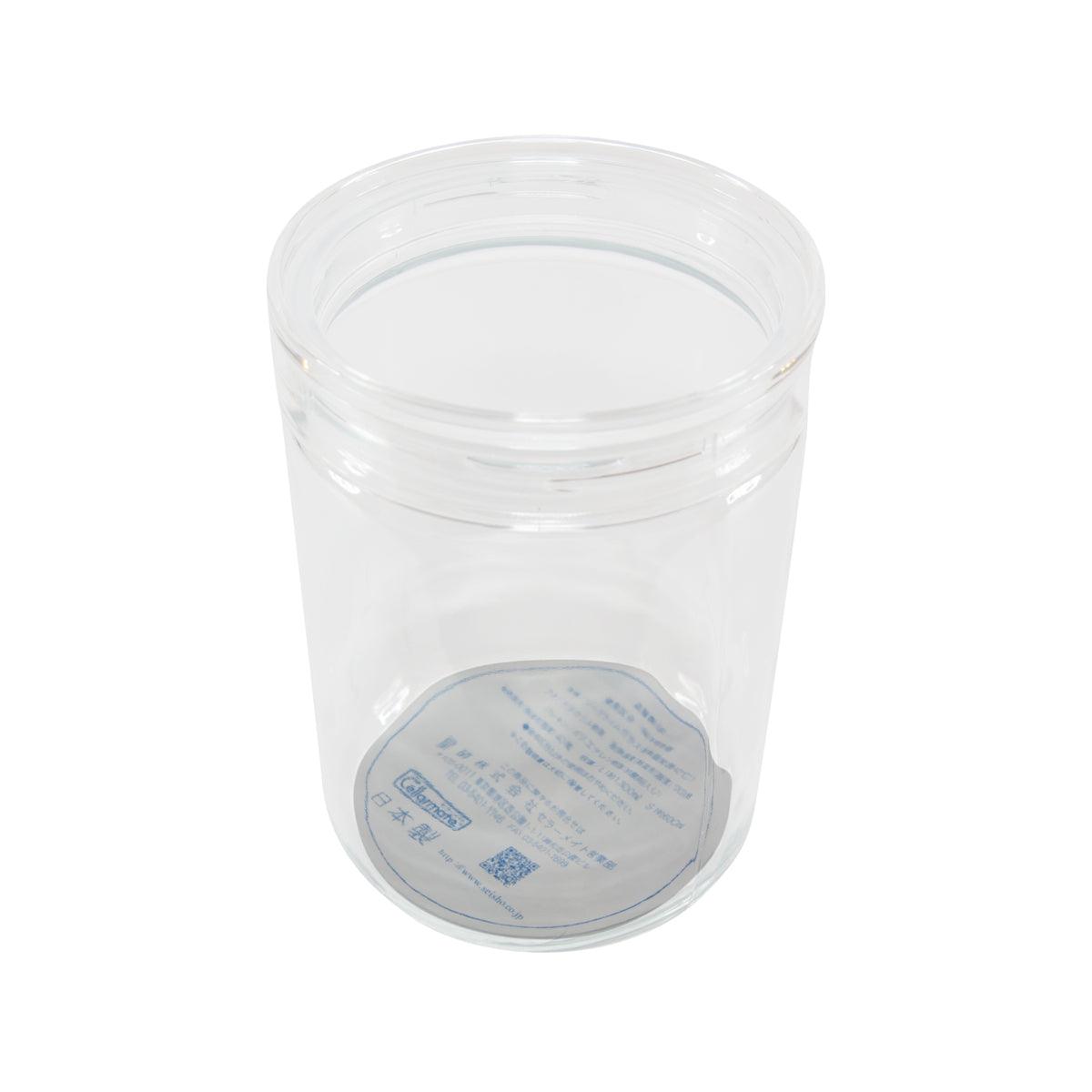 Clear plastic jar with screw-on lid and round printed label area