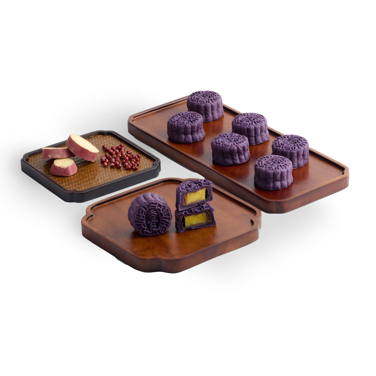 Assorted mini mooncakes with purple patterned tops and red bean centers