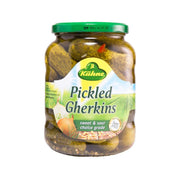 KUHNE sweet and sour pickled gherkins in a glass jar with green lid