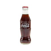 Coca-Cola Coke 250 mL glass bottle with red cap and front label