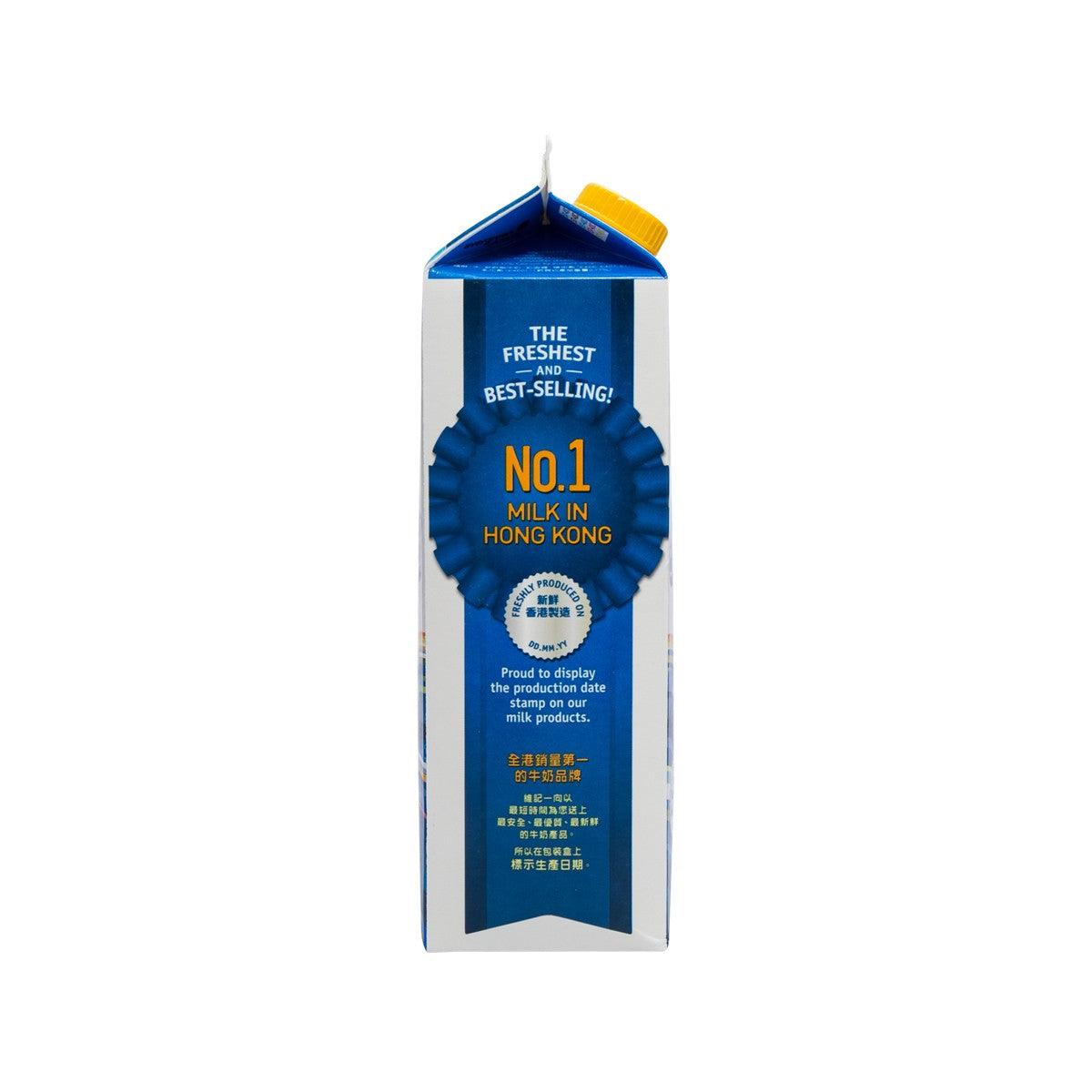 Hi-calcium skimmed milk drink carton with ribbon badge and product claim text.
