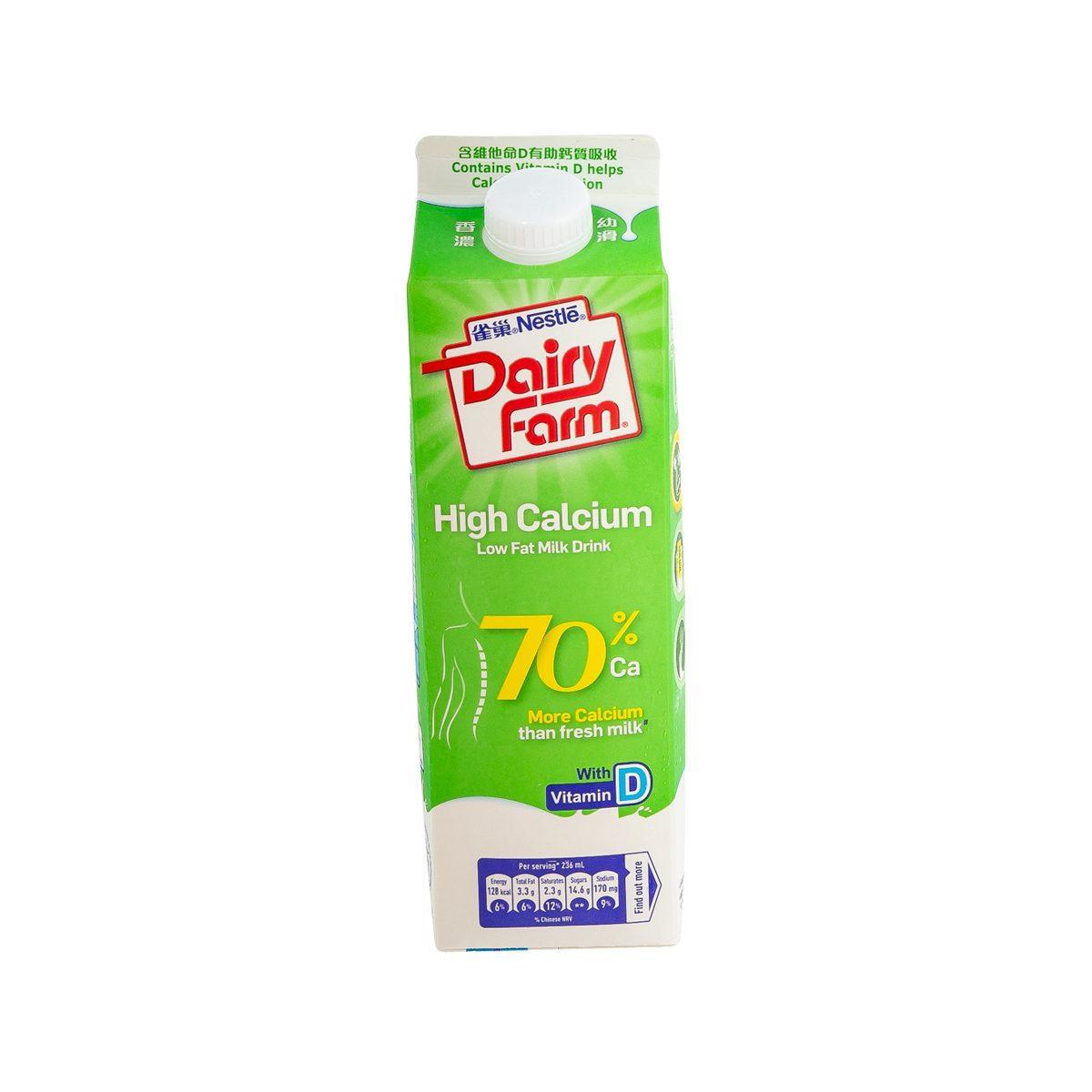 Green high-calcium low-fat milk drink carton with white cap and Dairy Farm logo