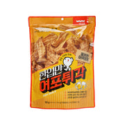 Crispy fish snack bag with fish cracker graphics, orange front, 50 g