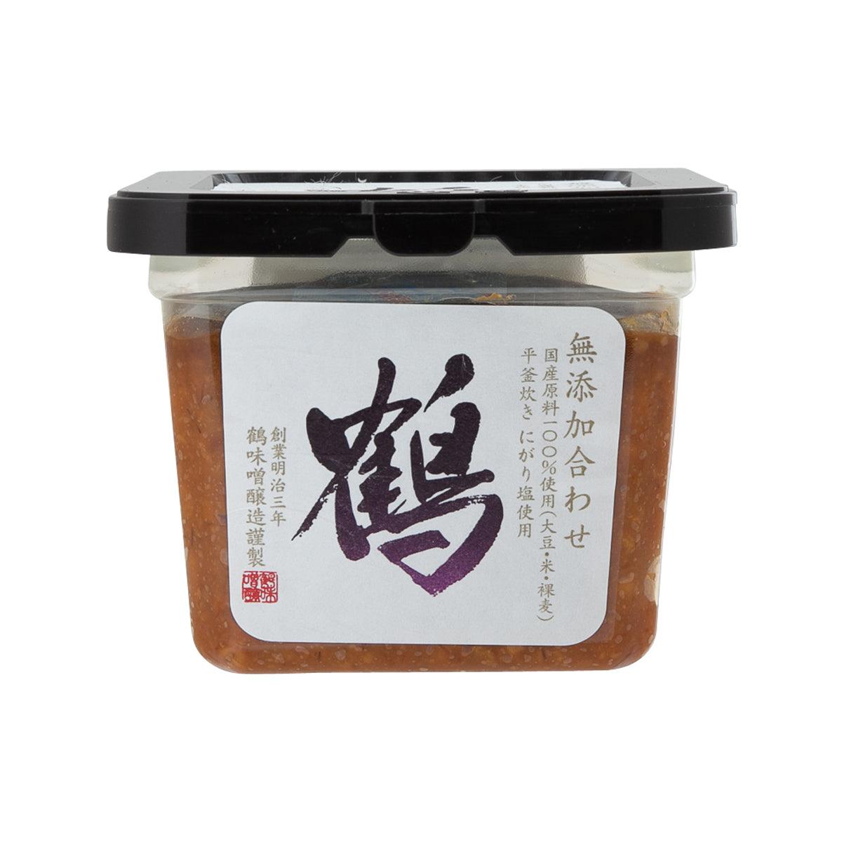 Mixed miso paste jar with black lid, clear sides, brown contents, Japanese label