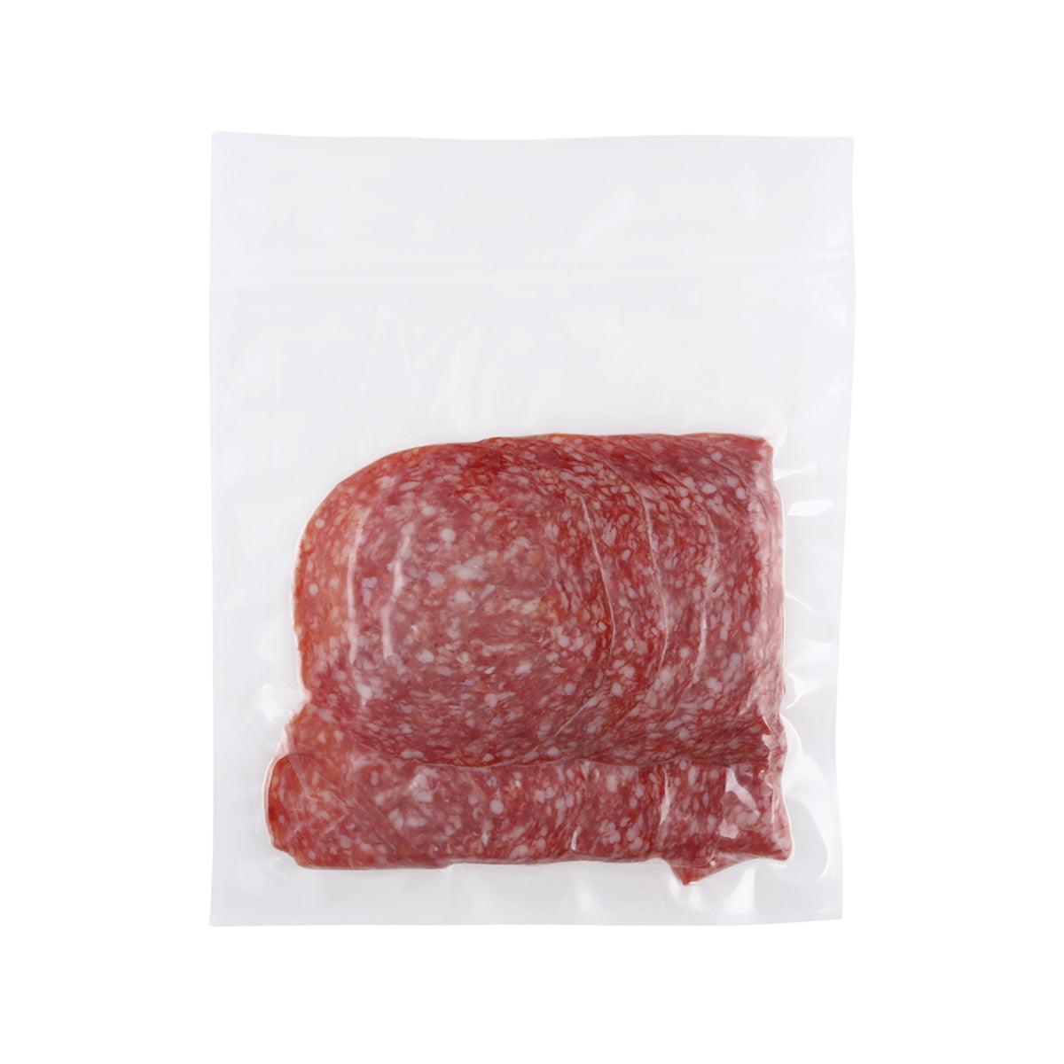 Vacuum-sealed sliced salami with red marbled cured meat in a clear bag