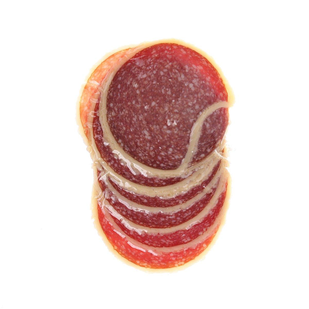 Parmesan-coated salami slices, red and speckled with cheese