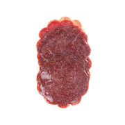 Sliced German salami, maroon-red cured meat with visible white fat specks