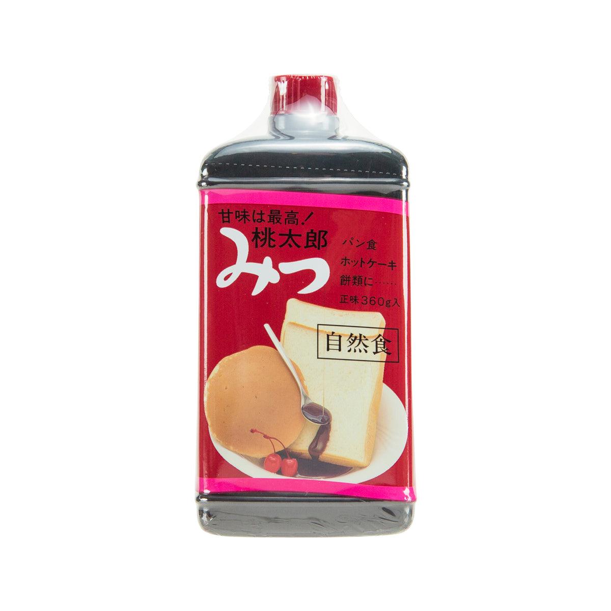 HIRANO Momotaro Black Syrup bottle, red label with white center, clear glass.
