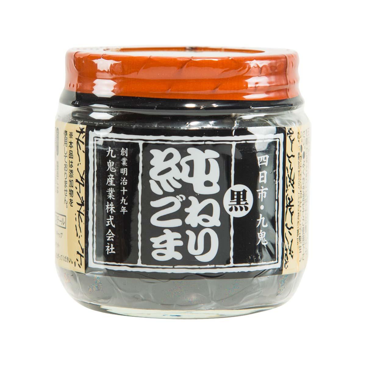 KUKI black sesame paste in a glass jar with orange lid and black label