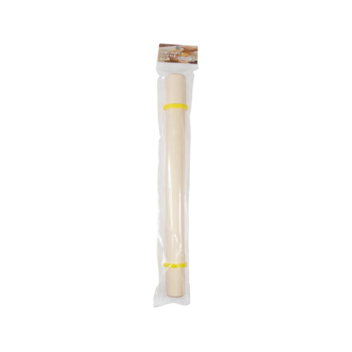KAI rolling pin with light wooden shaft and yellow end accents