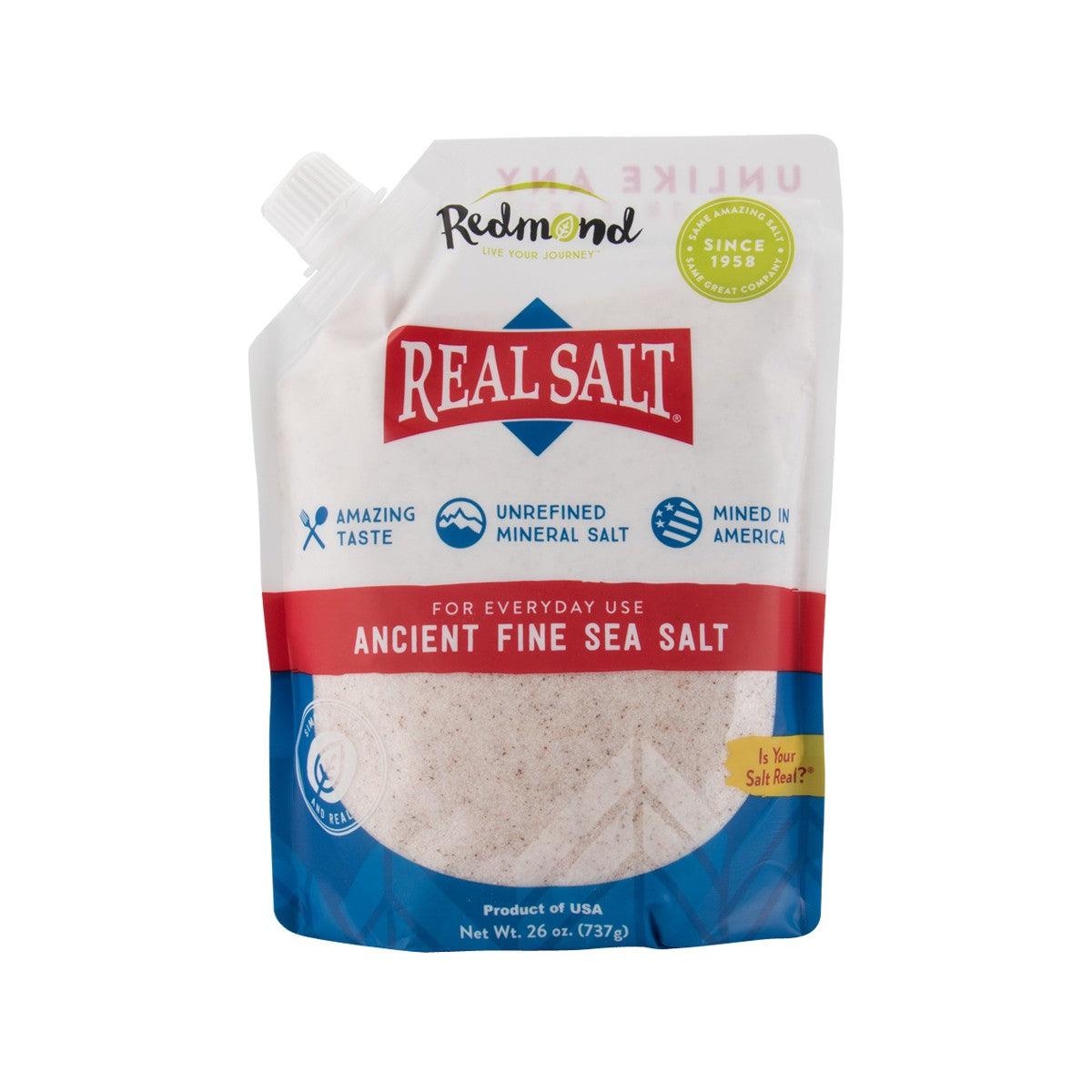 Ancient fine sea salt pouch with screw-top cap, white salt granules inside