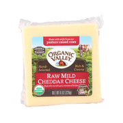 Raw mild cheddar cheese block in plastic wrap with organic front label, 226 g