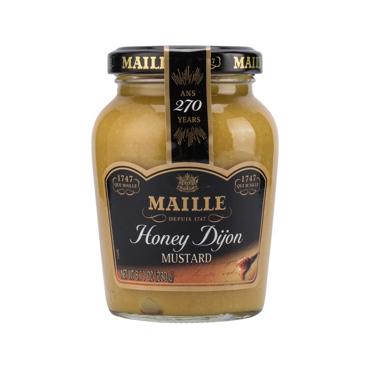 Dijon honey mustard jar with yellow-gold sauce, glass jar and metal lid