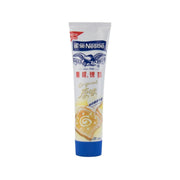 NESTLE Eagle sweetened condensed milk tube, white cream, front label view