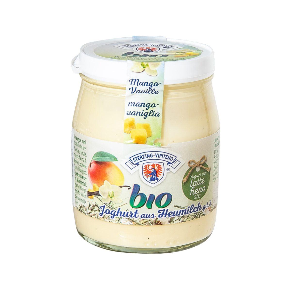 Organic yogurt jar with mango and vanilla label, glass container with lid