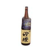 OKUNOMATSU Ginjo bottle, red cap and front label on dark brown glass.