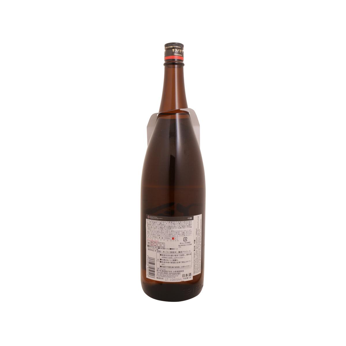 OKUNOMATSU Ginjo bottle, back label on dark brown glass with red cap.