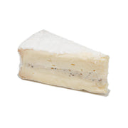 LES FRERES MARCHAND truffle brie cheese wedge, pale creamy color with small specks