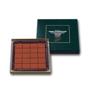 Nama chocolate box with 20 pieces, square caramel-brown chocolate squares in tray