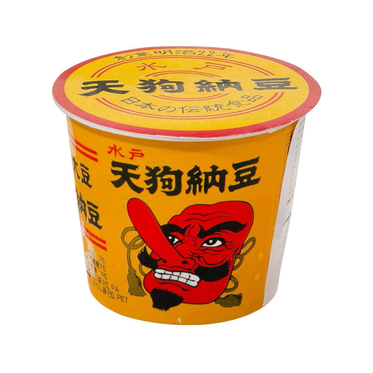 Natto cup with yellow lid and red tengu character graphic, Japanese label text
