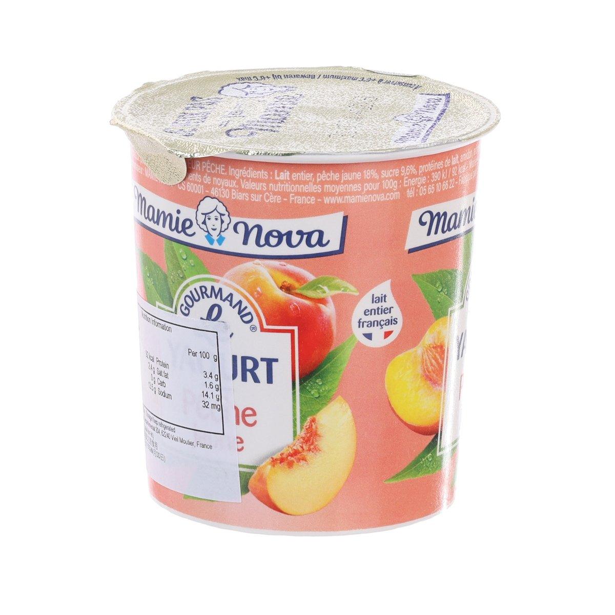 Mamie Nova peach yogurt cup, 150 g, top lid and side label with ingredients.