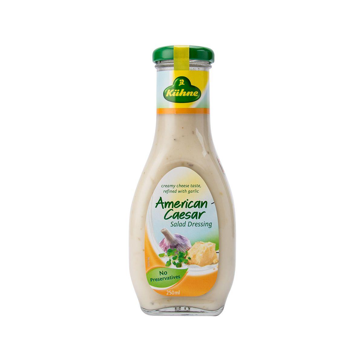KUHNE American Caesar salad dressing bottle with green cap and creamy beige label